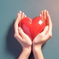 Charity Day symbol female hands hold a red heart tenderly