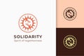 Charity or donation logo in hand and sun represent peace or solidarity