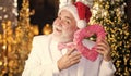 Charity and kindness. Christmas eve. Lovely greetings. Senior man celebrate christmas. Santa Claus. Kind grandpa with