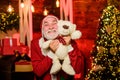 Charity and kindness. Lovely hug. Santa Claus. Mature man with white beard. Christmas spirit. Bearded grandfather senior