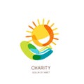 Charity logo design template. Abstract colorful sun on human hand. Royalty Free Stock Photo