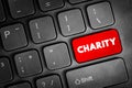 Charity - an organization set up to provide help and raise money for those in need text button on keyboard, concept background Royalty Free Stock Photo