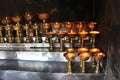 Charity. Praying candles in a monastery in Bhutan. Royalty Free Stock Photo