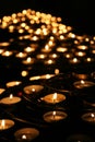 Charity. Praying candles in a temple. Royalty Free Stock Photo