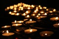 Charity. Praying candles in a temple. Royalty Free Stock Photo