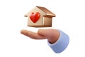 Charity, real estate and family home concept - closeup picture of human hand holding gold house with red heart isolated