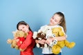 Charity sale. Love and friendship. Kids adorable cute girls play soft toys. Happy childhood. Child care. Sisters best