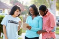 Charity Worker Collecting From Couple In Street Royalty Free Stock Photo