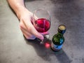 Close up of a man hand holding a glass of Sandeman porto Royalty Free Stock Photo