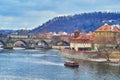 Charles Bridge against the Petrin Hill, Prague, Czechia Royalty Free Stock Photo