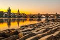 Charles Bridge with Old Town Bridge Tower reflected in Vltava River at morning sunrise time, Prague, Czech Republic Royalty Free Stock Photo