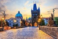 Charles Bridge and Old Town Bridge Tower in Prague at sunrise