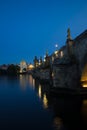 Charles Bridge in Prague during twilight side view Royalty Free Stock Photo