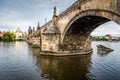 Charles Bridge in Prague against sky at sunset