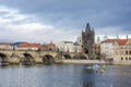 Charles Bridge Prague with Police boat on patrol Royalty Free Stock Photo