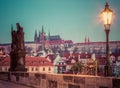 Charles Bridge at sunrise, Prague, Czech Republic. View on Prague Castle with St. Vitus Cathedral. Royalty Free Stock Photo