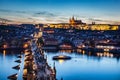 Charles Bridge on Vltava river in Prague, Czech Republic at late sunset, night. Prague Castle Royalty Free Stock Photo