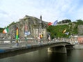 Charles-de-Gaulle Bridge with many giant saxophone sculptures and the Collegiate Church of Notre-Dame in Background, Dinant Royalty Free Stock Photo