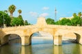 Charles III bridge over the Segura river in Rojales in Alicante province Spain. Summer sunny day blue sky green trees reflections Royalty Free Stock Photo