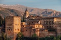 Charles V Palace and Church of Santa Maria de la Alhambra in medieval fortress complex with Sierra Nevada snowy mountains, Royalty Free Stock Photo