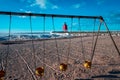 Charlevoix, MI /USA - March 3rd 2018: A shot of Charlevoix Michigan beach through a swingset