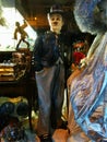 Charlie Chaplin figure is standing between other art