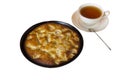 Charlotte. Apple pie with a cup of black tea on a white background Royalty Free Stock Photo