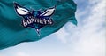 Charlotte Hornets flag waving on a clear day