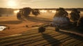 Charm of a cozy cottage surrounded by a meadow during sunrise