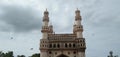 Charminar in hydrabad and black cloud and flying bird beside