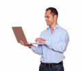 Charming adult man working on laptop computer