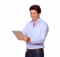Charming adult man working on tablet pc