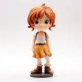 Charming Anime Figurine: Orange-haired Girl On Desk
