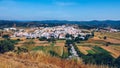 Charming architecture of hilly Aljezur, Algarve, Portugal. View to the small town of Aljezur with traditional portuguese houses Royalty Free Stock Photo