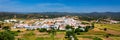 Charming architecture of hilly Aljezur, Algarve, Portugal. View to the small town of Aljezur with traditional portuguese houses Royalty Free Stock Photo