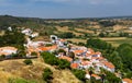 Charming architecture of hilly Aljezur, Algarve, Portugal. View to the small town of Aljezur with traditional portuguese houses Royalty Free Stock Photo