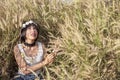 Charming Asian female relaxing outdoors on a sunny day Royalty Free Stock Photo