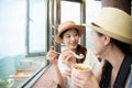 Asian girls eating famous yam taro balls