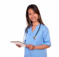 Charming asiatic nurse woman using her tablet pc Royalty Free Stock Photo