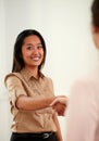 Charming asiatic woman giving hands greeting