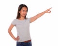 Charming asiatic young woman pointing to left up