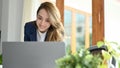 Charming Asian businesswoman working in her office, using laptop computer Royalty Free Stock Photo