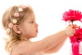 Charming baby girl holding red flower Royalty Free Stock Photo