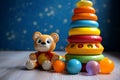 Charming baby toys scattered artfully on a neutral surface