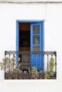 Charming balcony with blue door and cactuses in Frigiliana - Spanish white village Andalusia