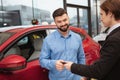 Car dealer selling new autos at the dealership Royalty Free Stock Photo