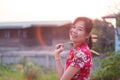 Charming beautiful Chinese woman standing and smiling with haapy