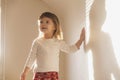 Charming beautiful girl plays with her shadow Royalty Free Stock Photo