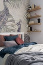 Charming bedroom with shelves Royalty Free Stock Photo