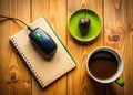 Charming Black Mouse Beside a Notebook on a Wooden Kitchen Table An Overhead Perspective Royalty Free Stock Photo
